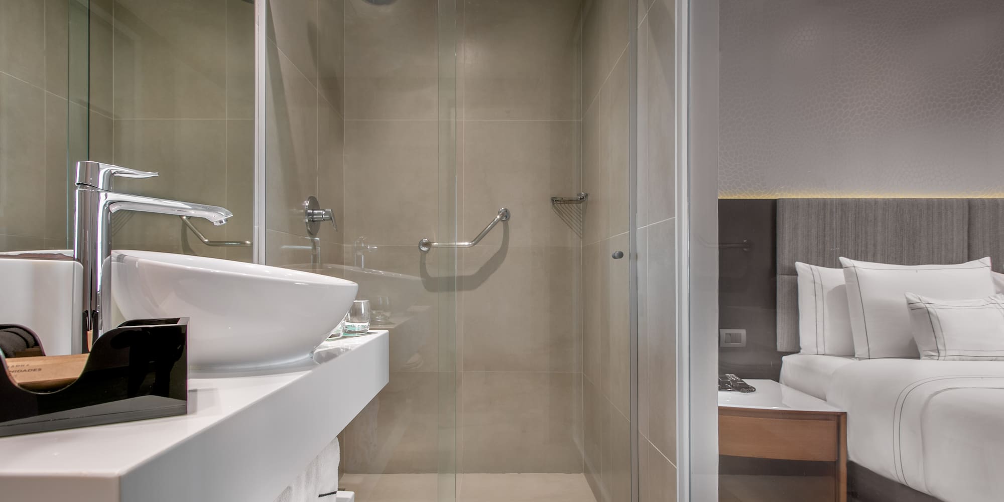a bathroom with a glass shower door