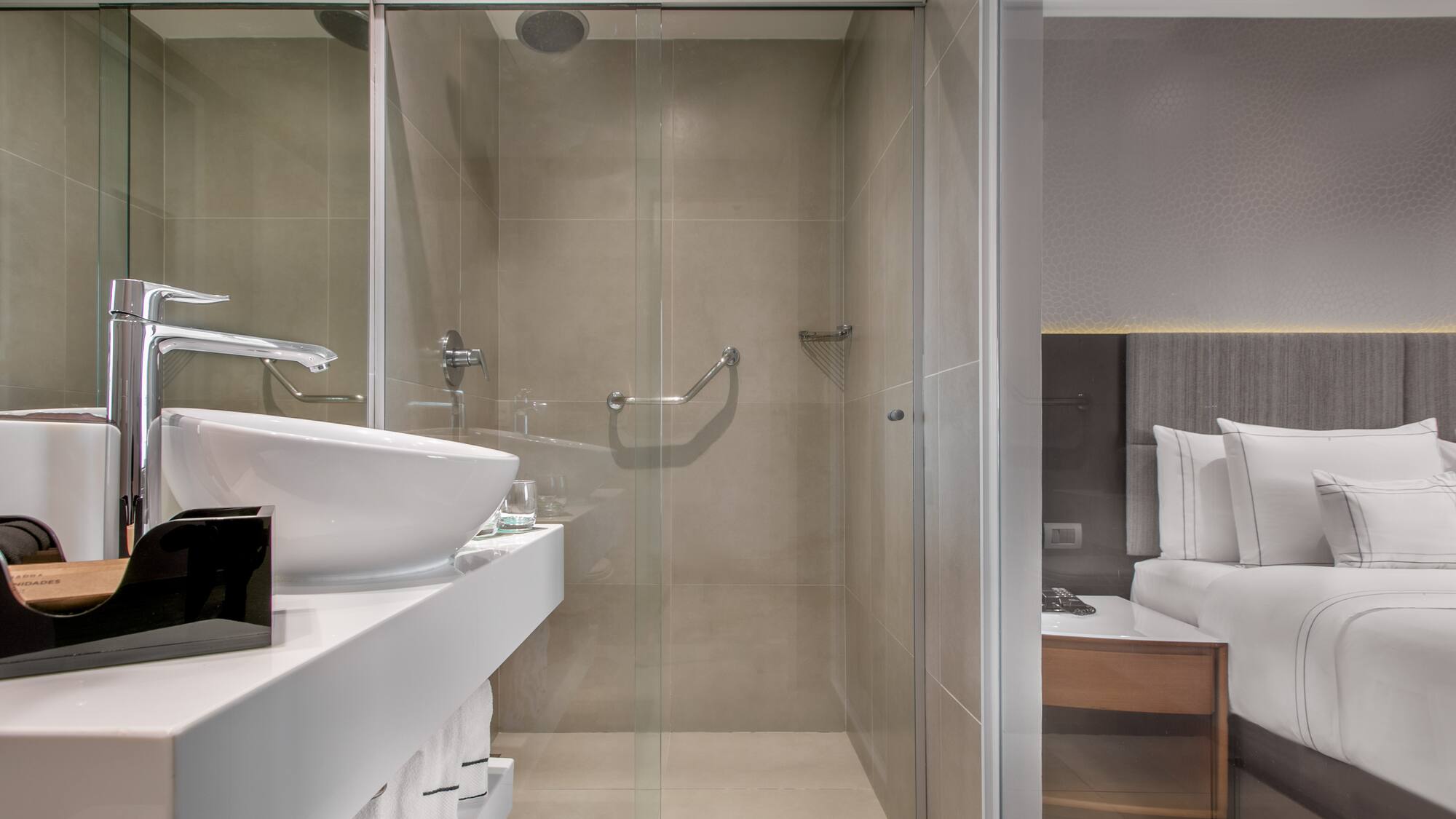 a bathroom with a glass shower door