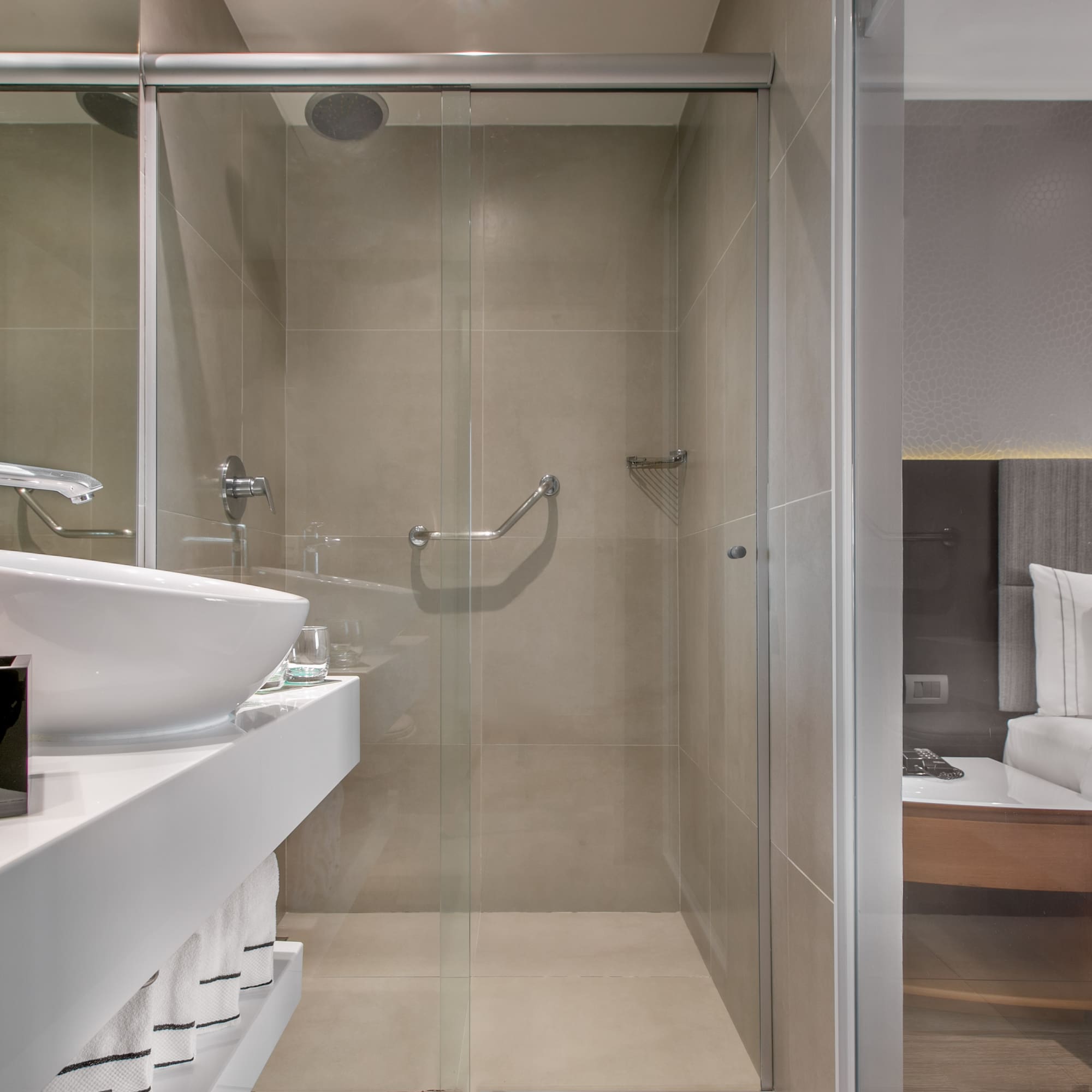 a bathroom with a glass shower door