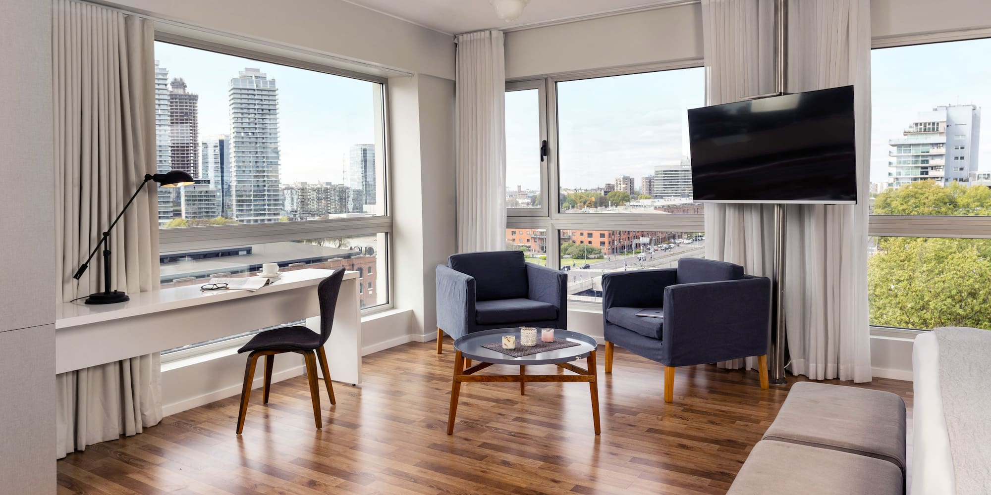 a living room with a television and a table