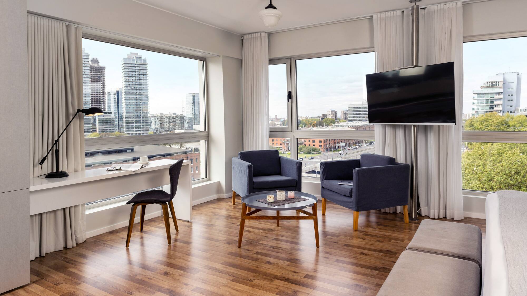 a living room with a television and a table