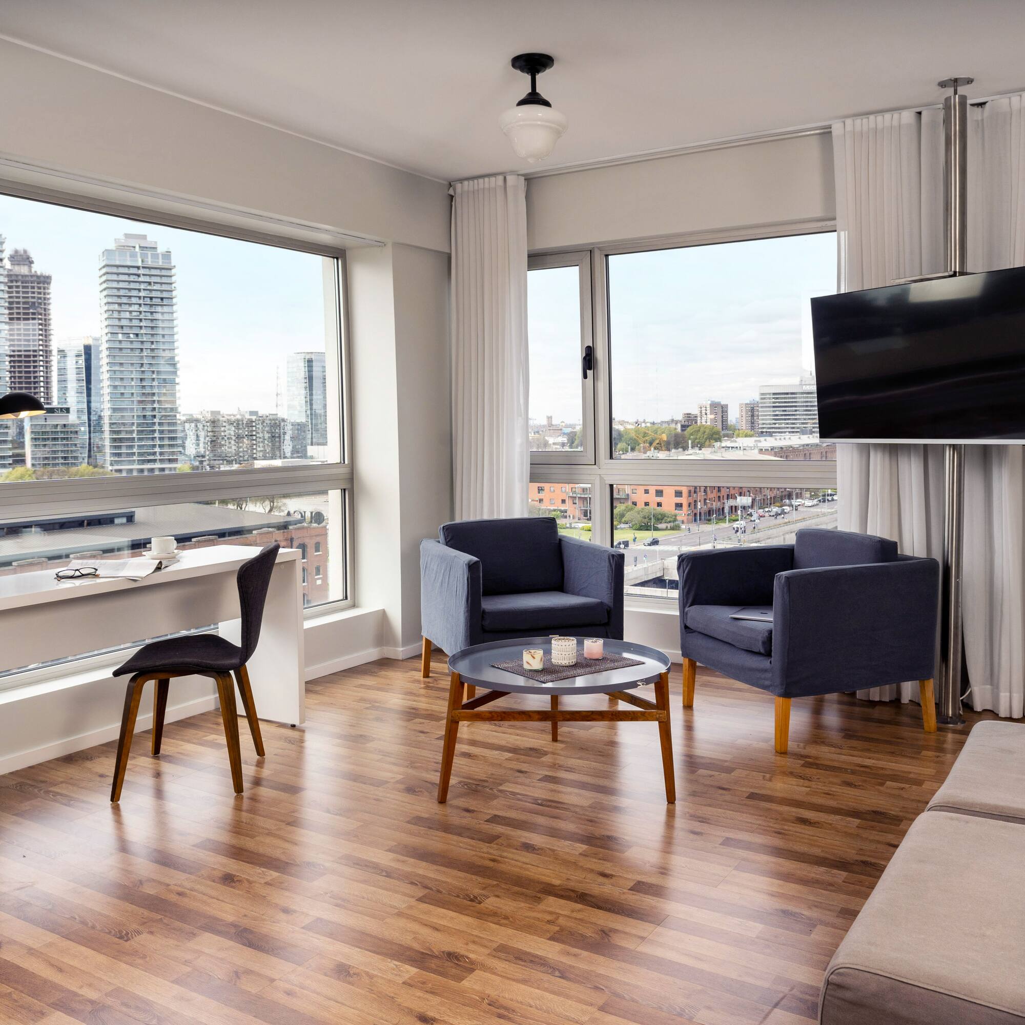 a living room with a television and a table