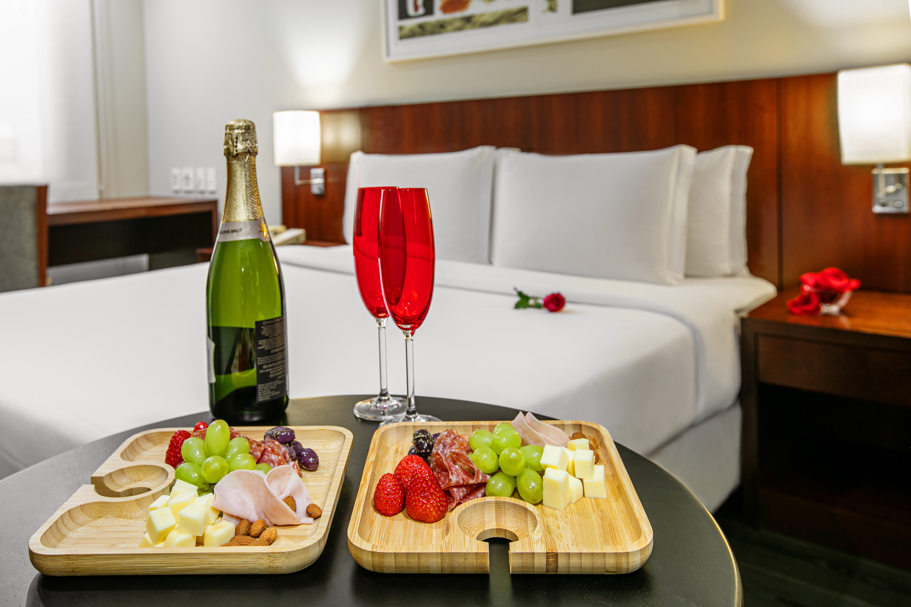 a table with food and wine glasses on it.