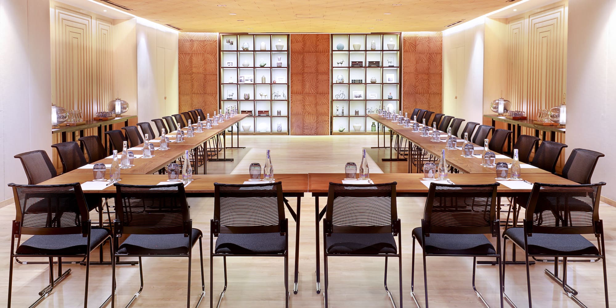 a room with a long table and chairs