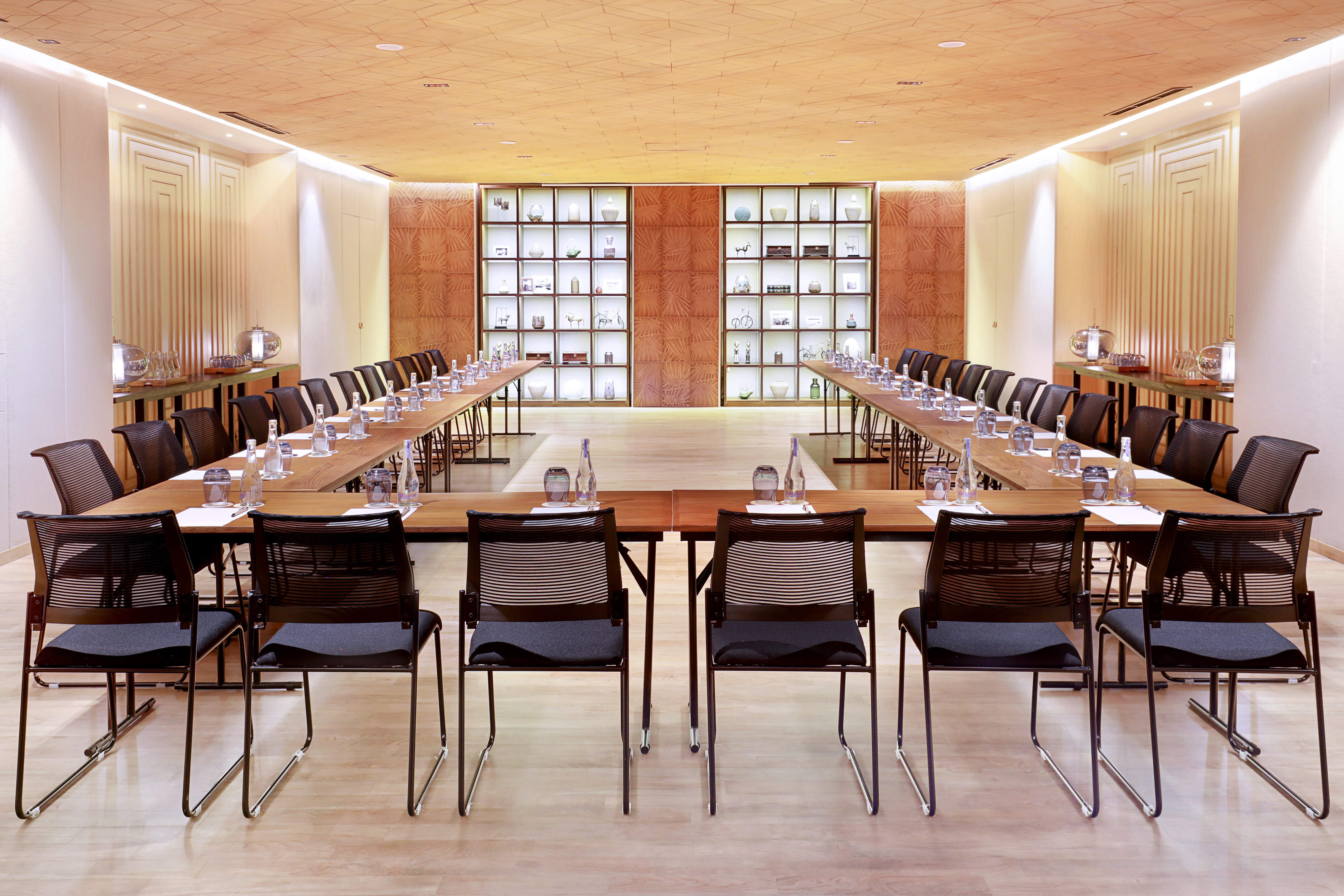 a room with a long table and chairs