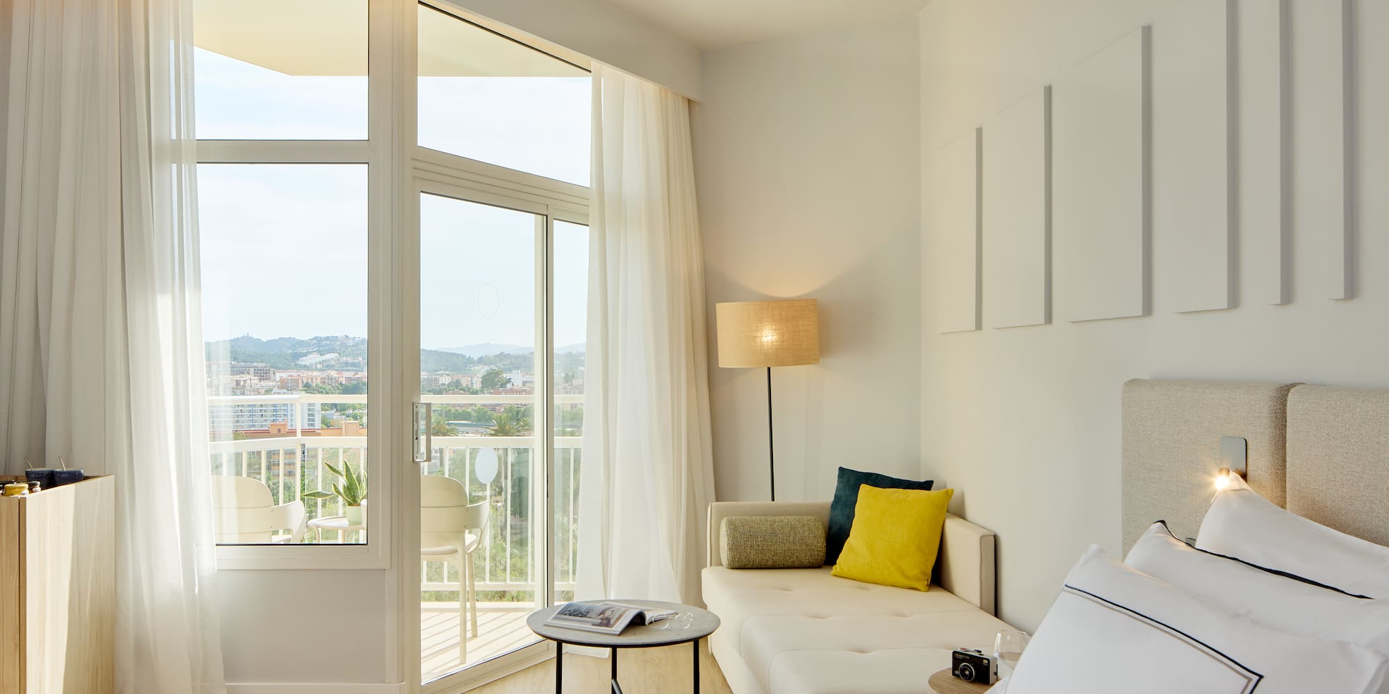 a bedroom with a couch and a bed