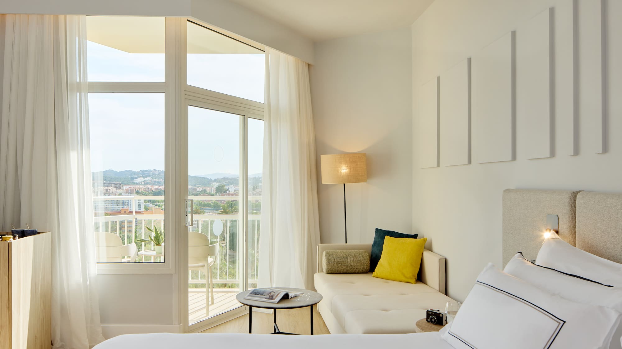 a bedroom with a couch and a bed