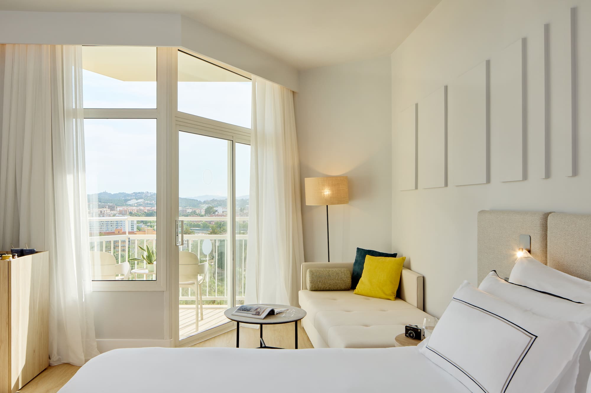 a bedroom with a couch and a bed