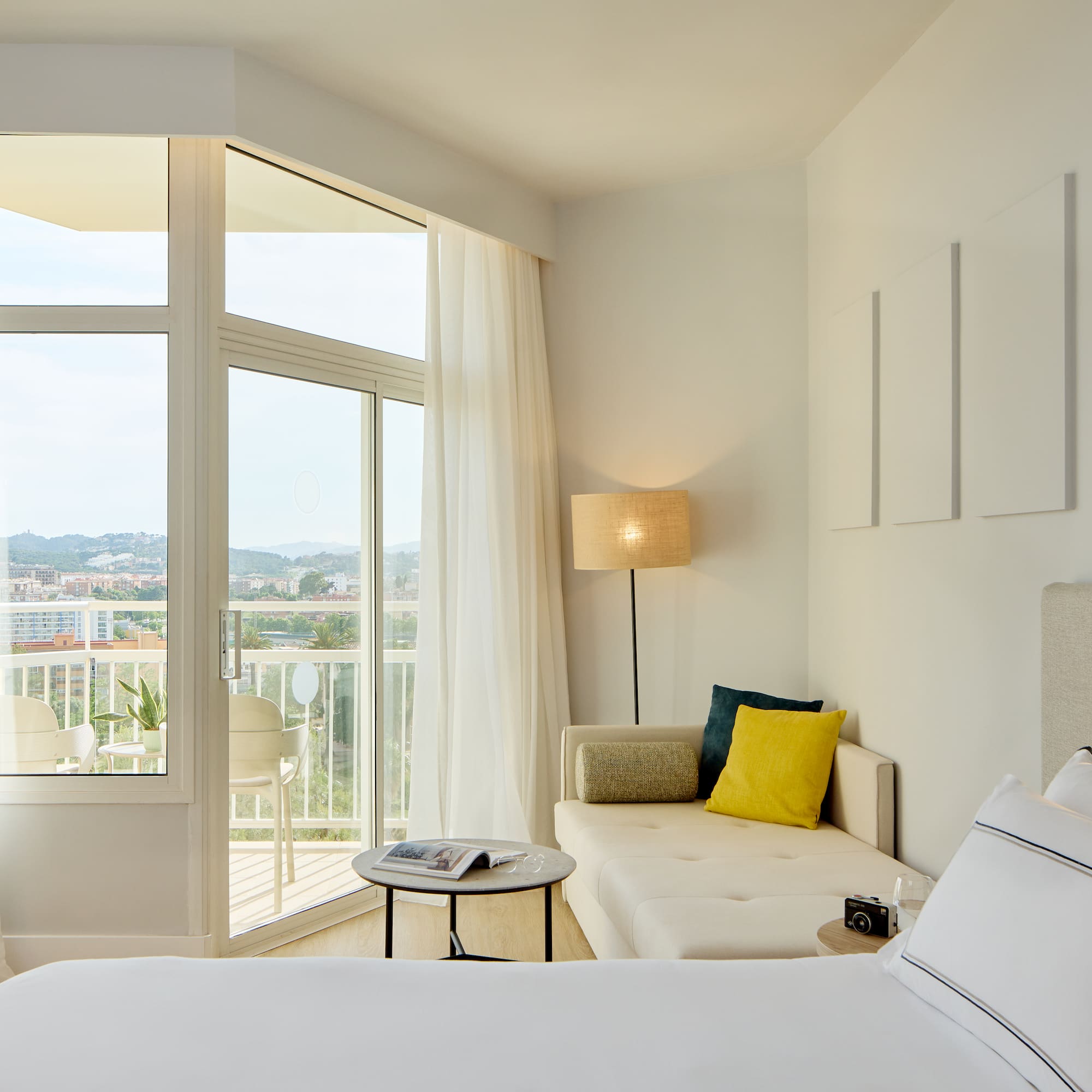 a bedroom with a couch and a bed