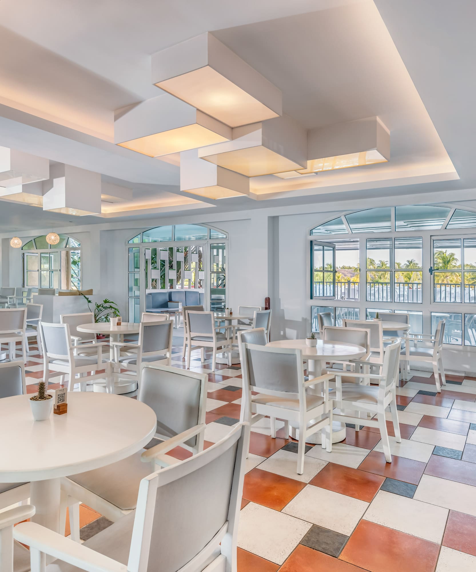 a room with tables and chairs