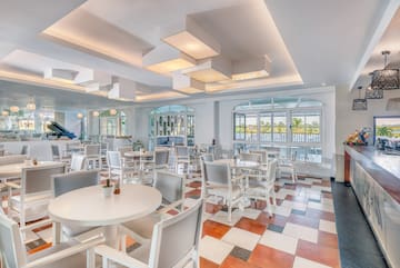 a room with tables and chairs