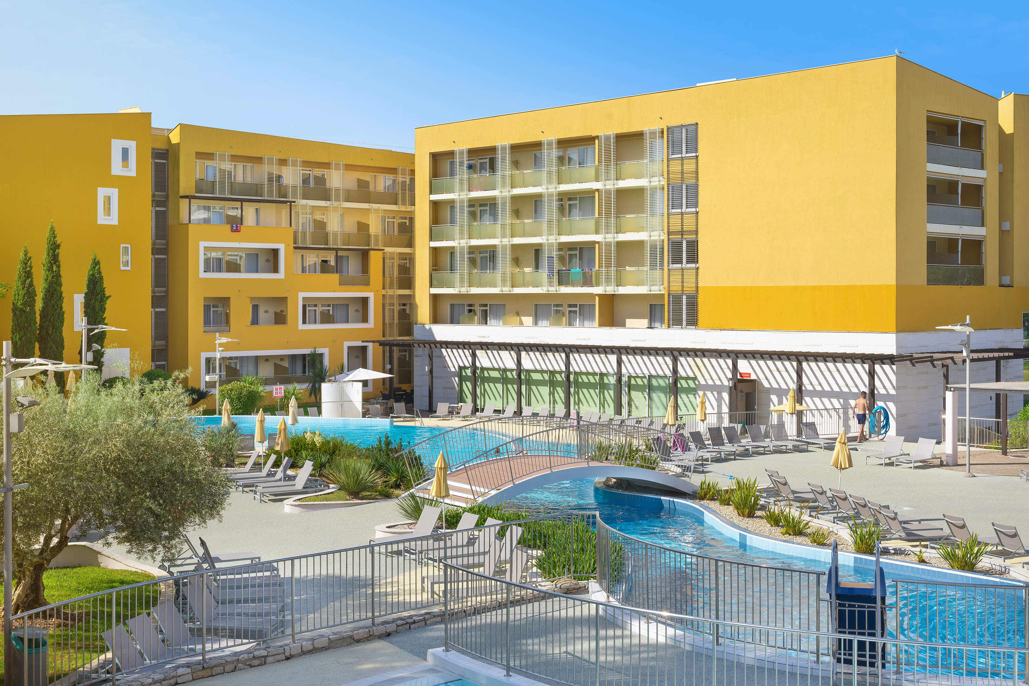 a pool in front of a building
