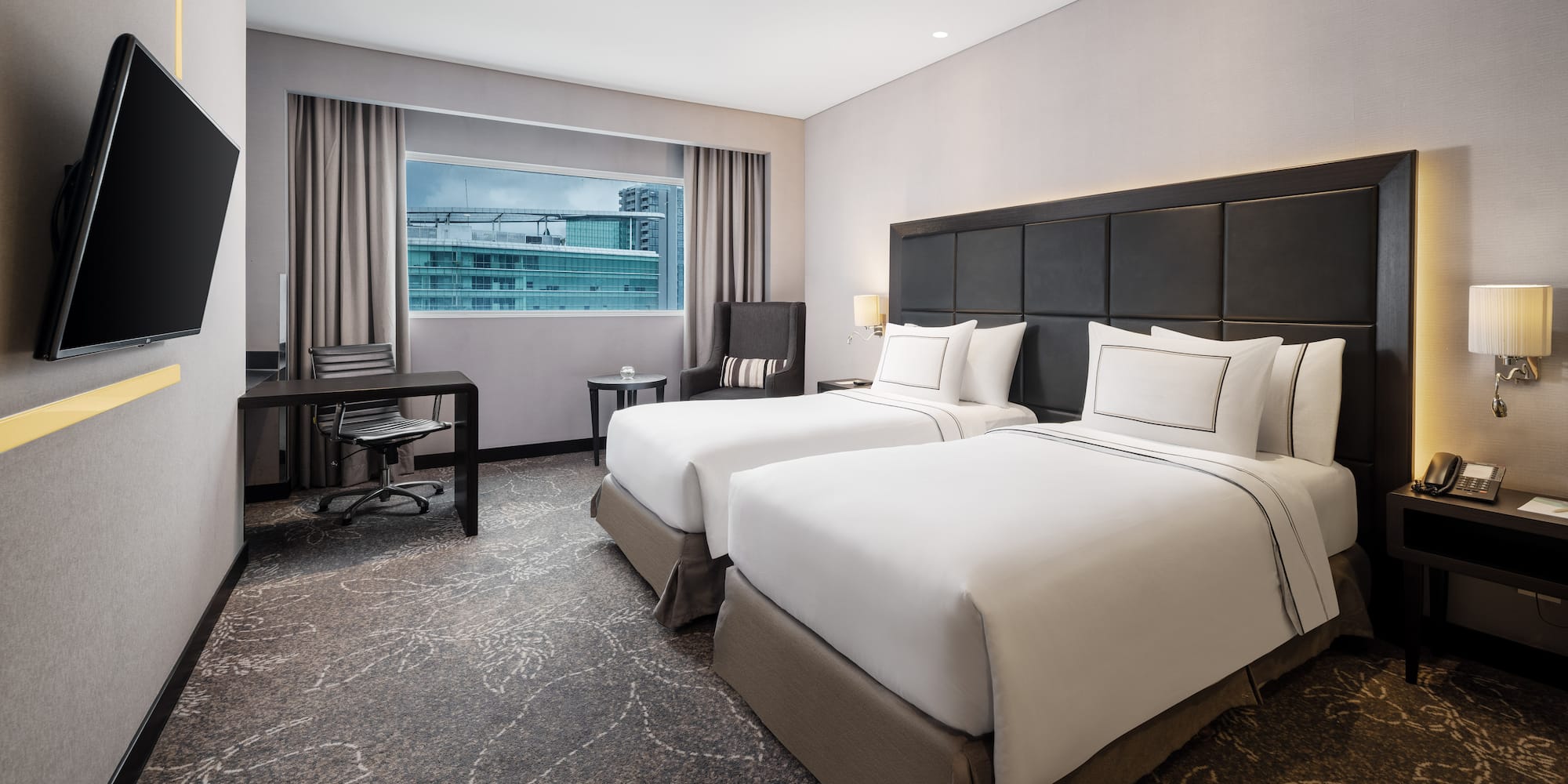 a hotel room with two beds