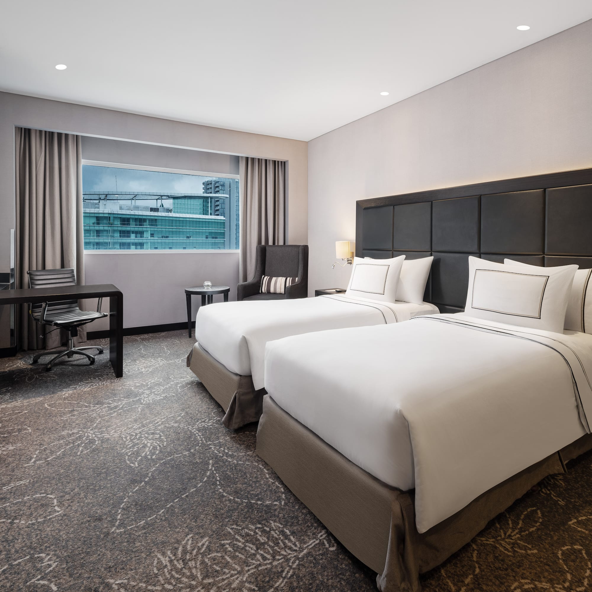 a hotel room with two beds