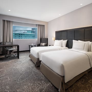 a hotel room with two beds