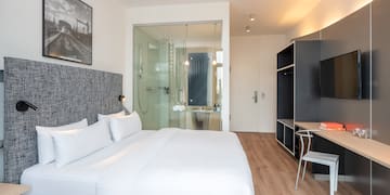 a room with a bed and a desk