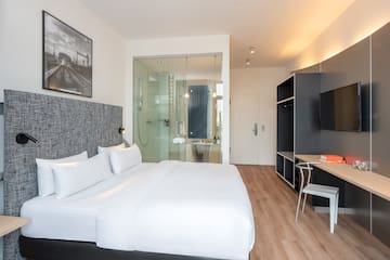 a room with a bed and a desk