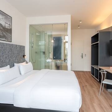 a room with a bed and a desk