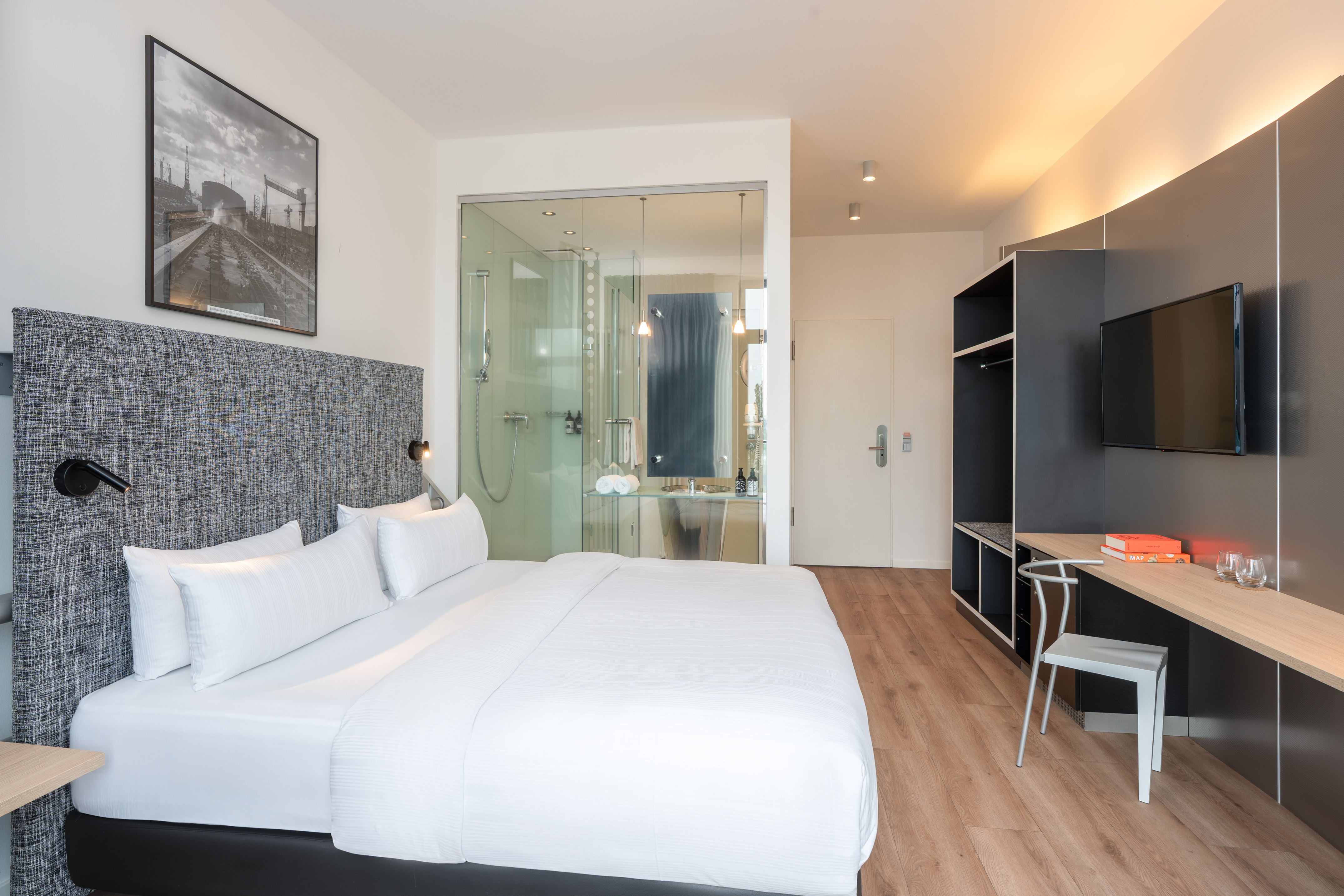 a room with a bed and a desk