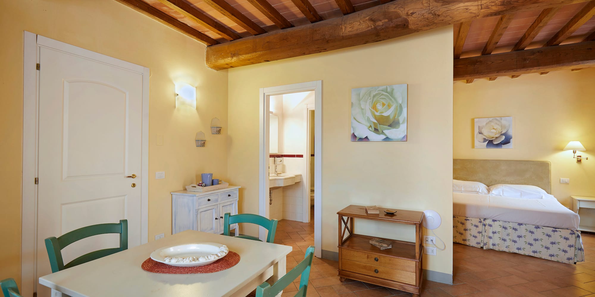 a room with a table and chairs