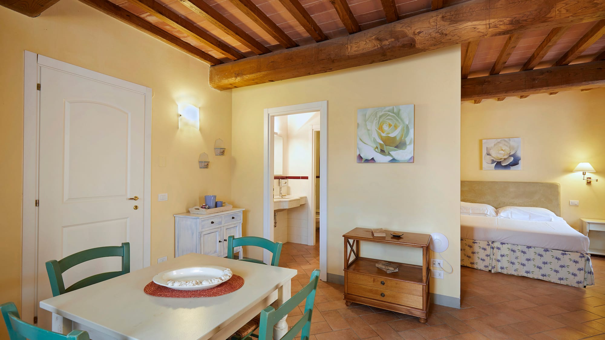 a room with a table and chairs