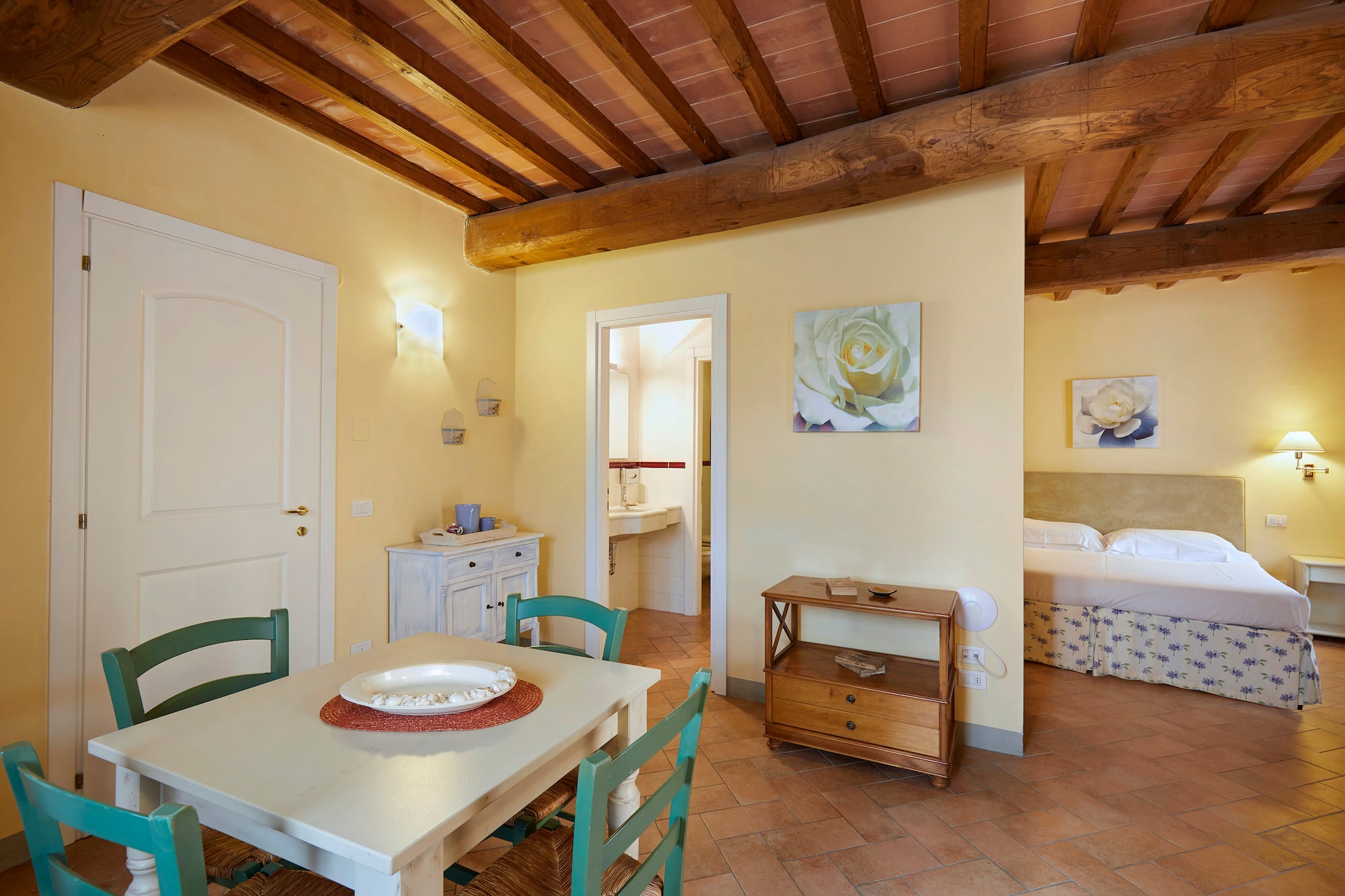 a room with a table and chairs