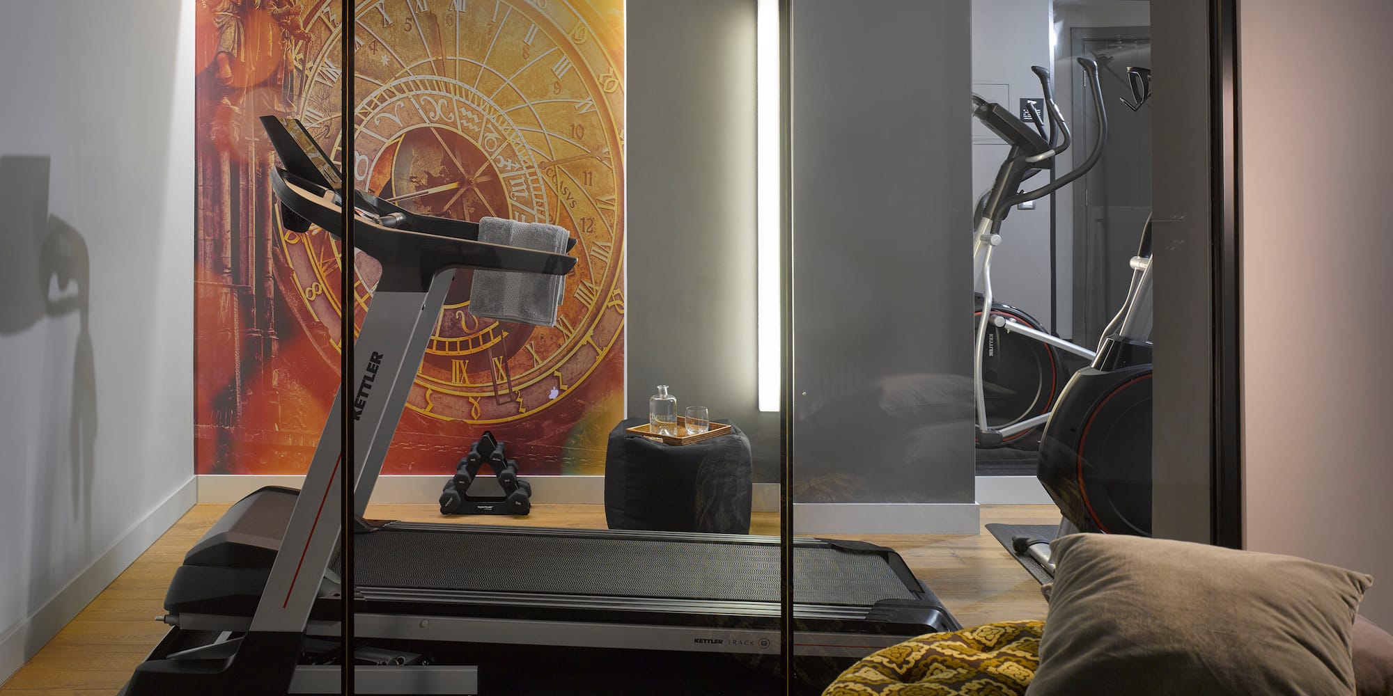 a room with a treadmill and exercise equipment