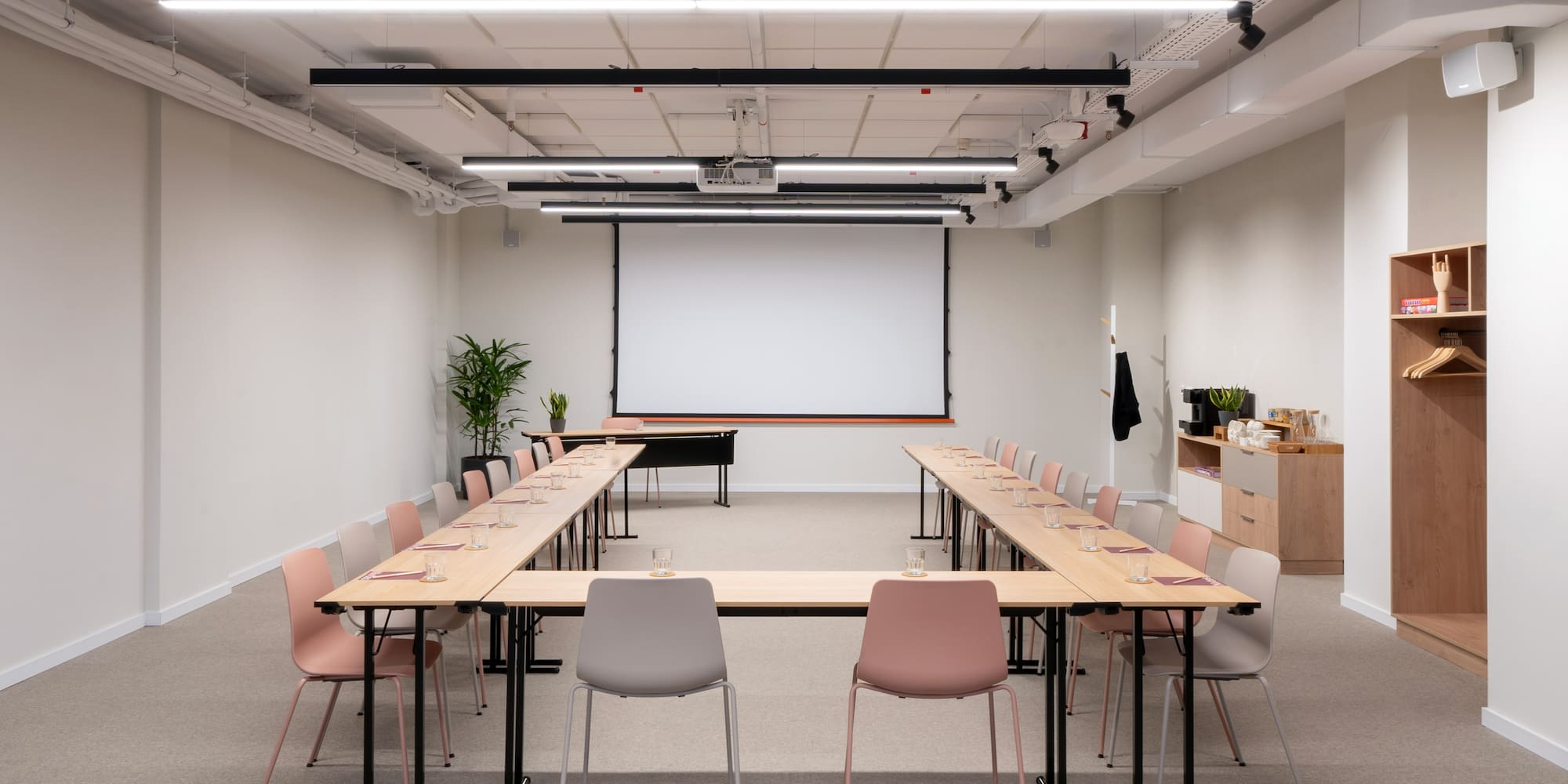 a room with a large table and chairs