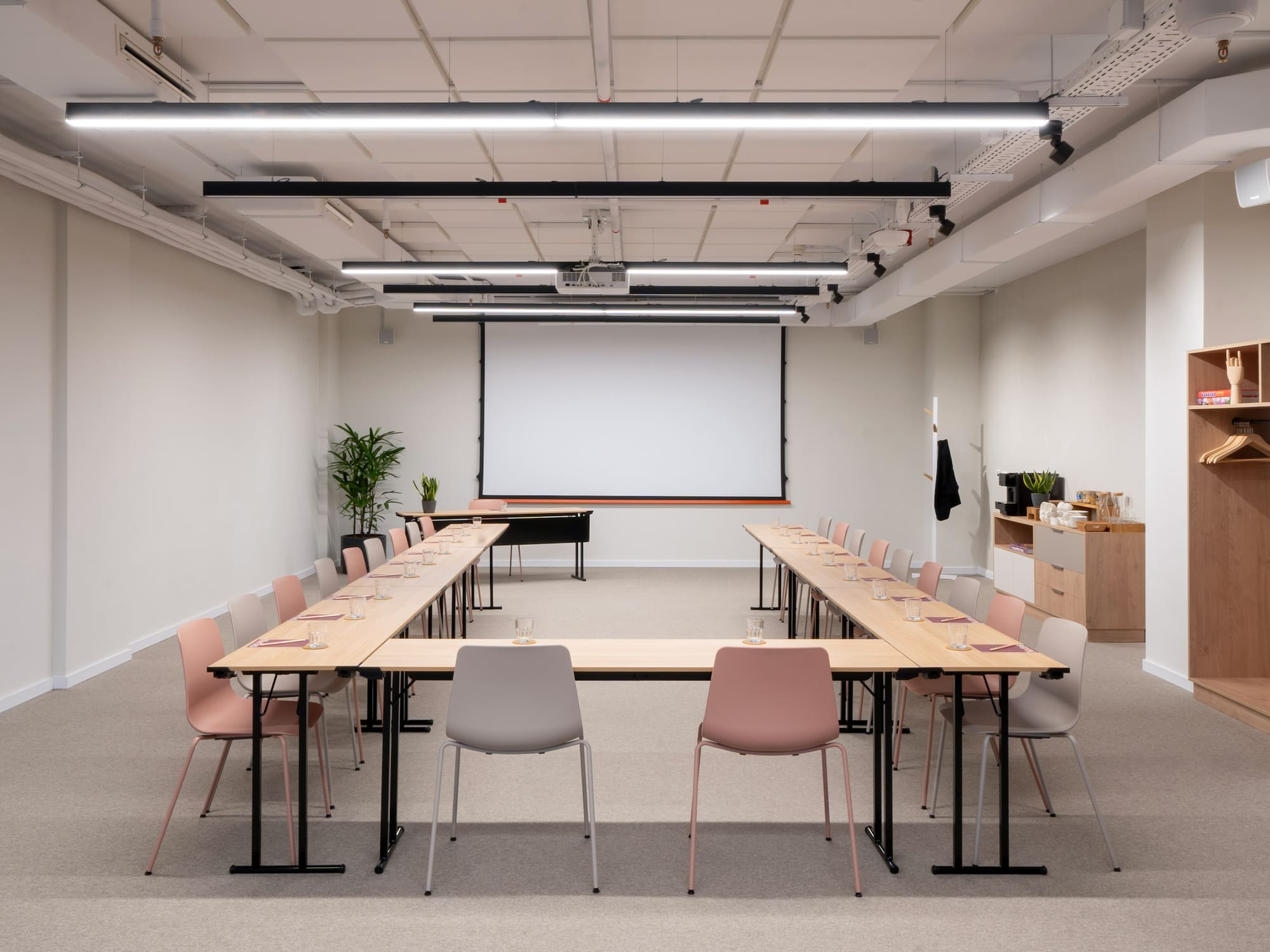 a room with a large table and chairs