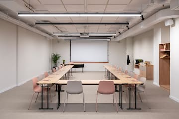 a room with a large table and chairs