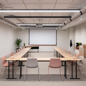 a room with a large table and chairs