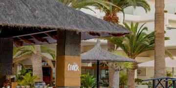 a building with palm trees
