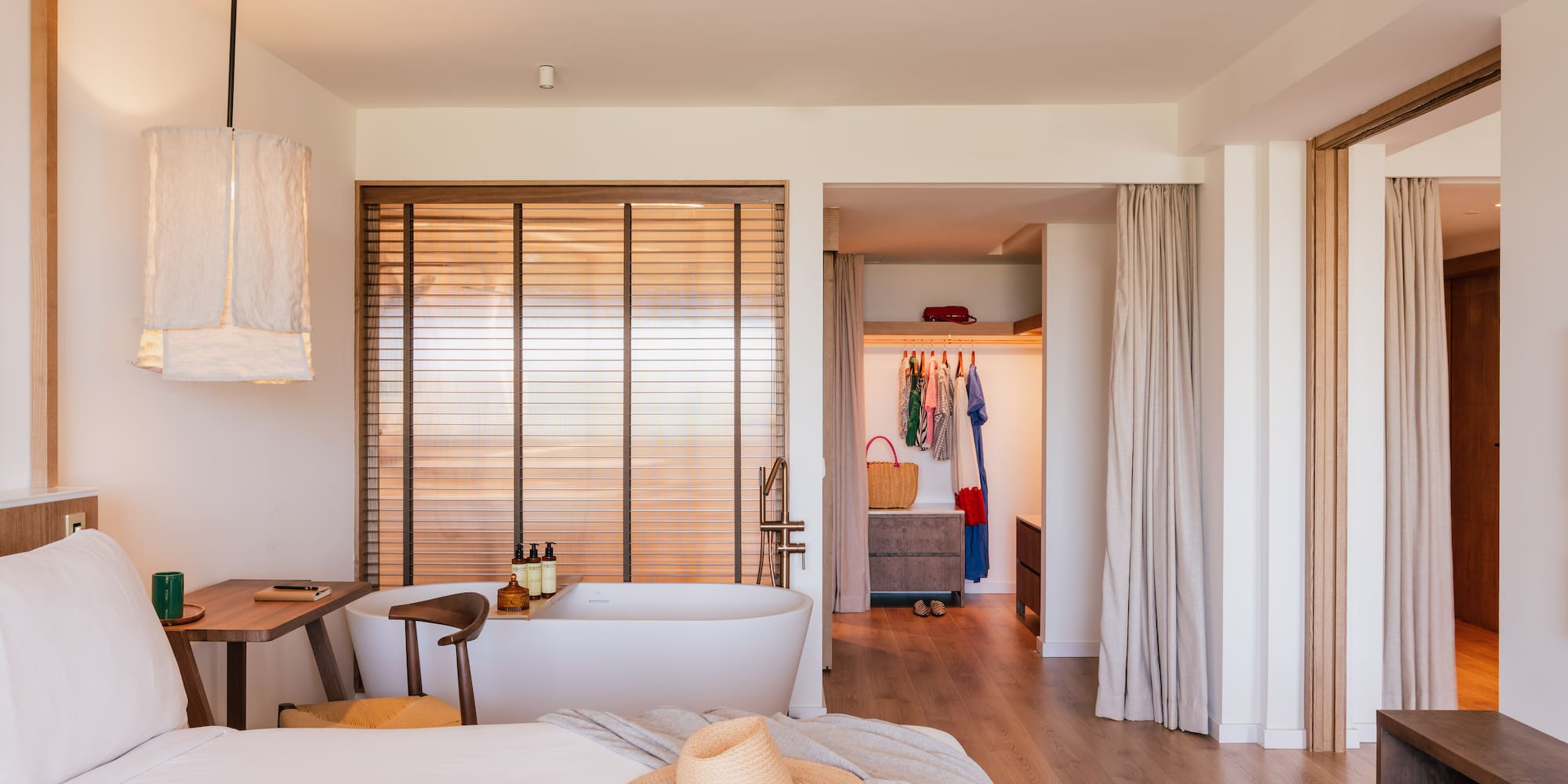 a room with a bed and a bathtub