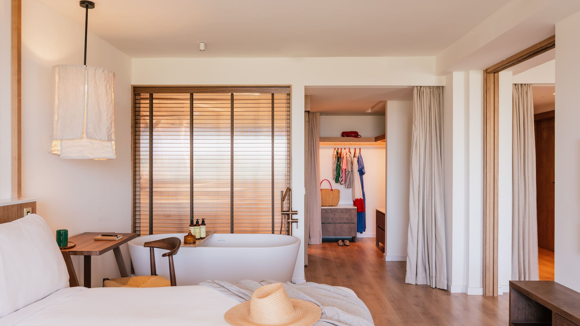 a room with a bed and a bathtub