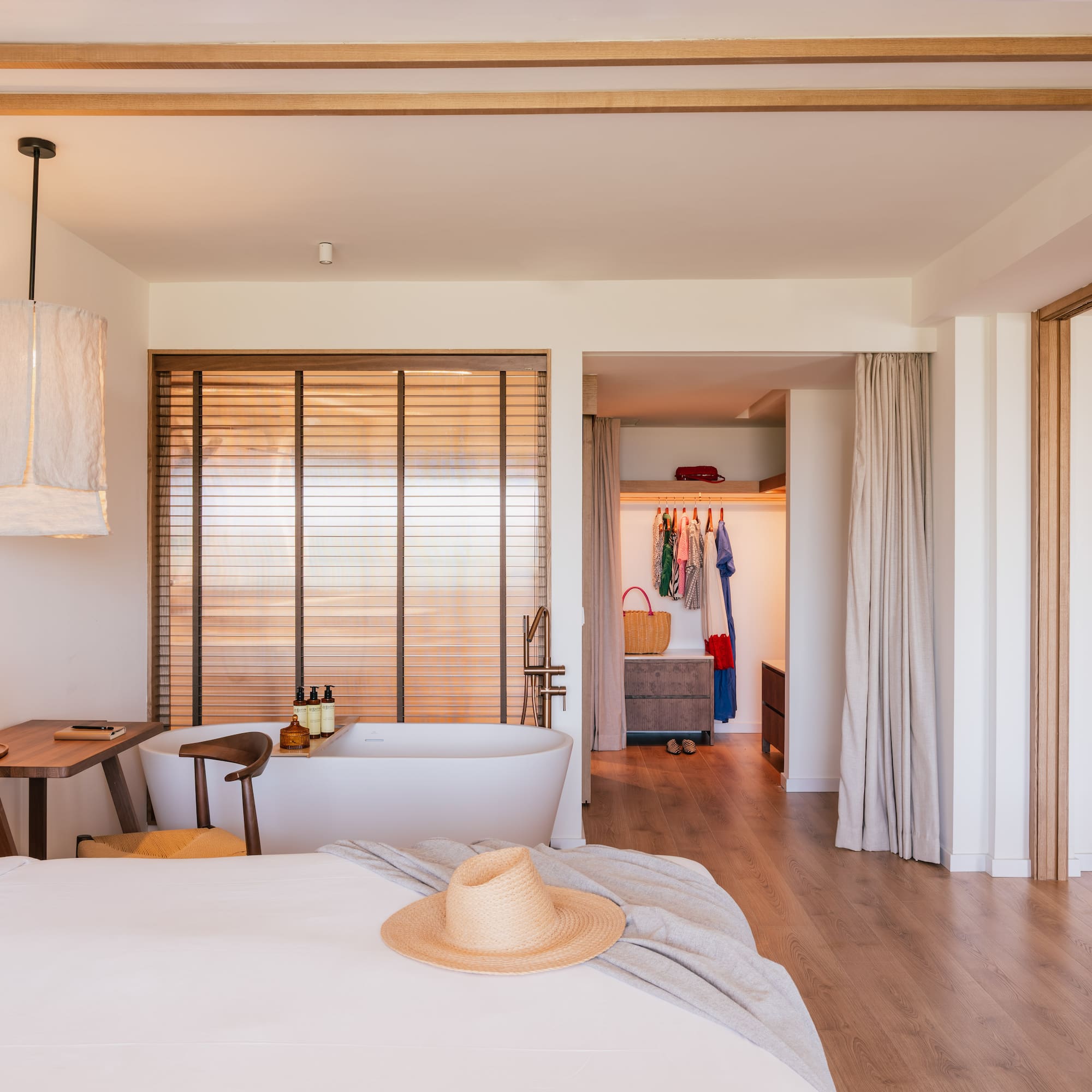 a room with a bed and a bathtub