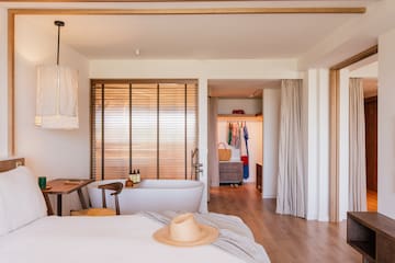 a room with a bed and a bathtub