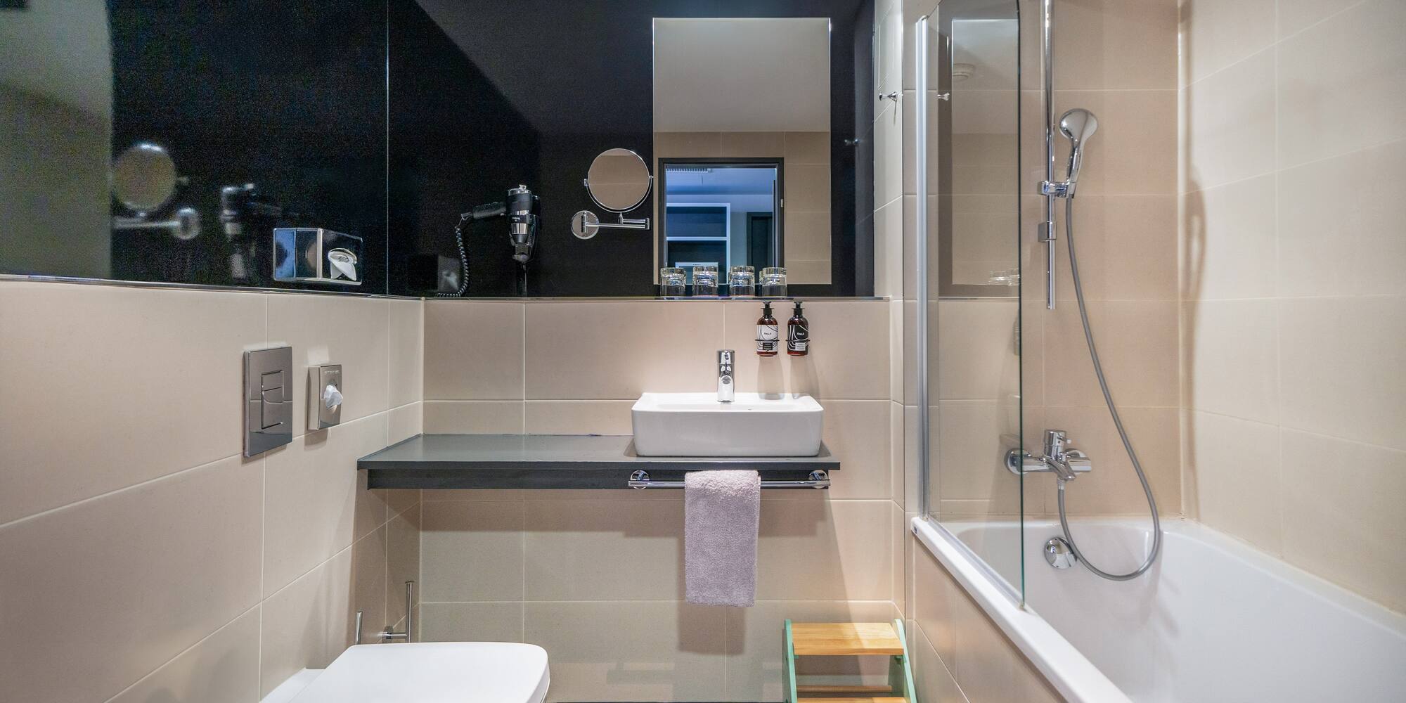 a bathroom with a sink and shower