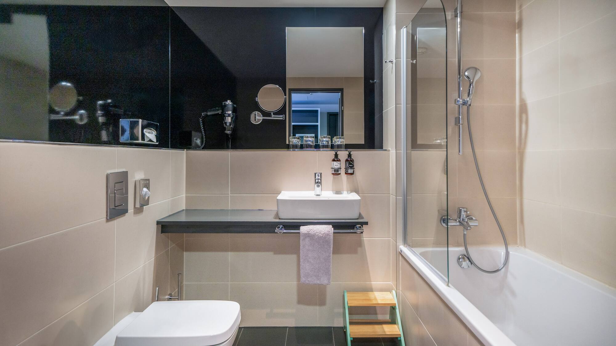 a bathroom with a sink and shower