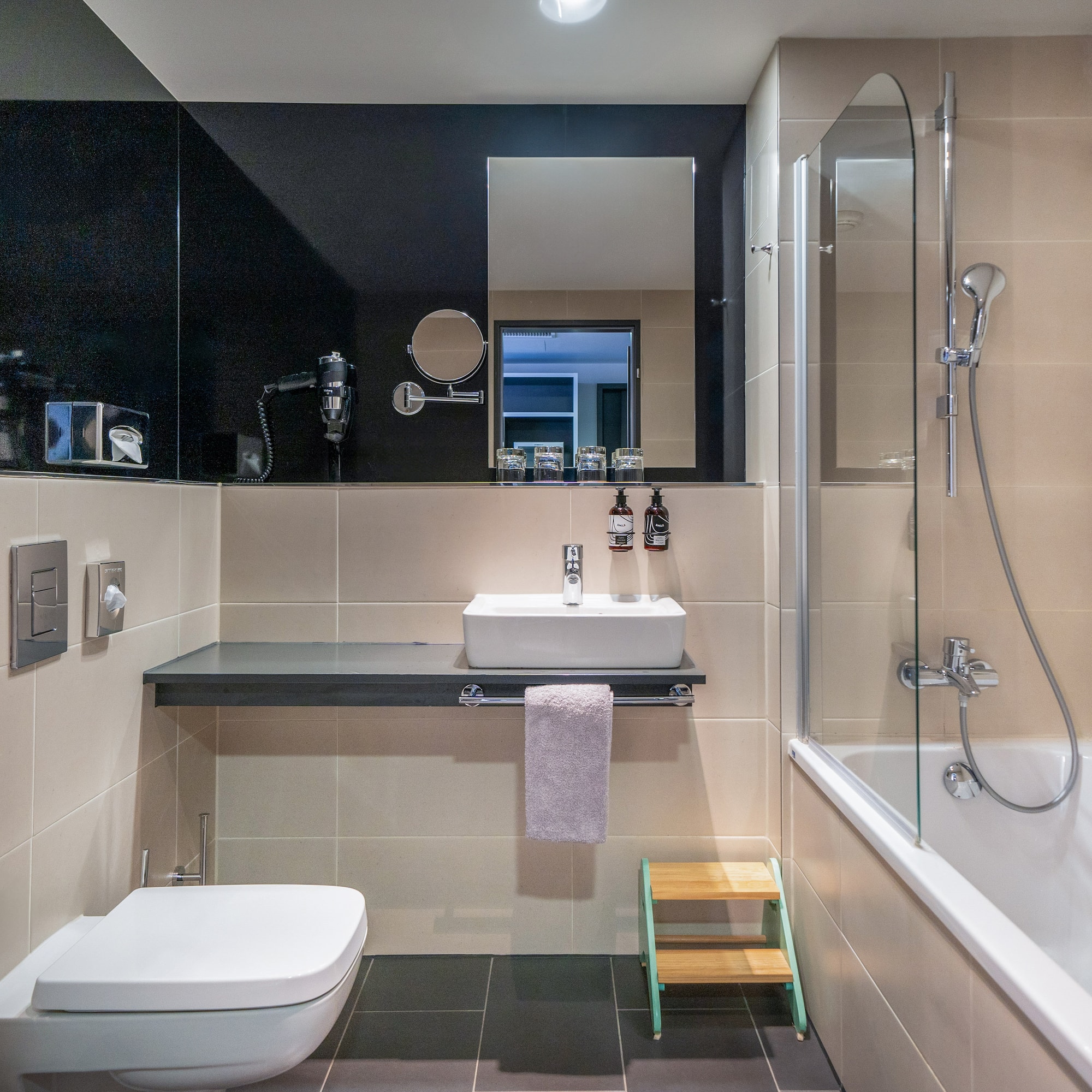 a bathroom with a sink and shower