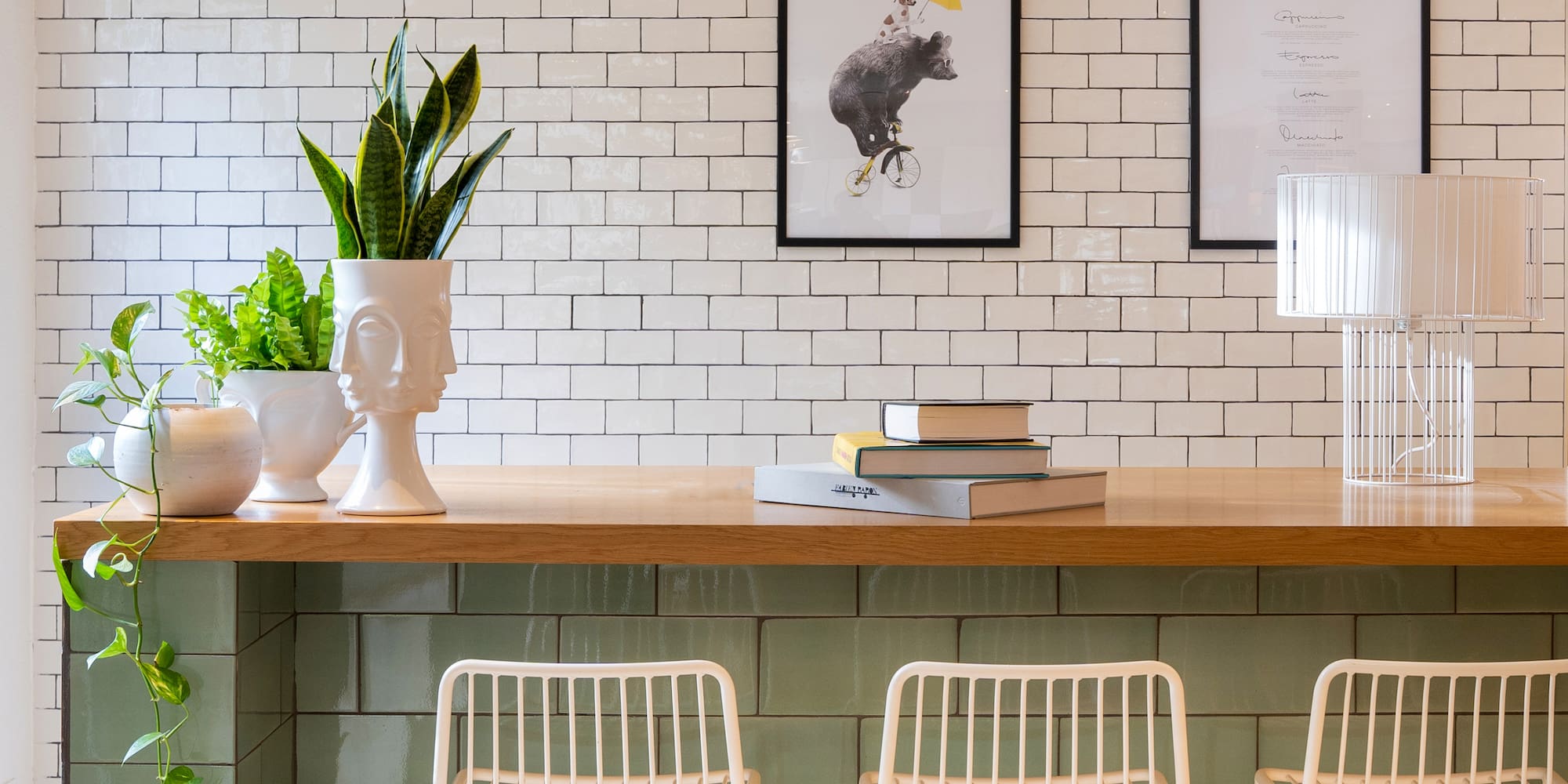 a table with a plant and books on it