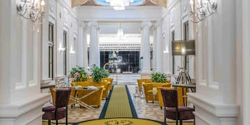 a hallway with chairs and tables