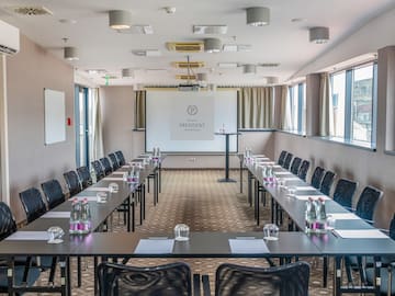 a room with tables and chairs