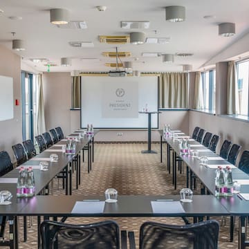 a room with tables and chairs