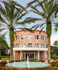 a building with a fountain in front of it