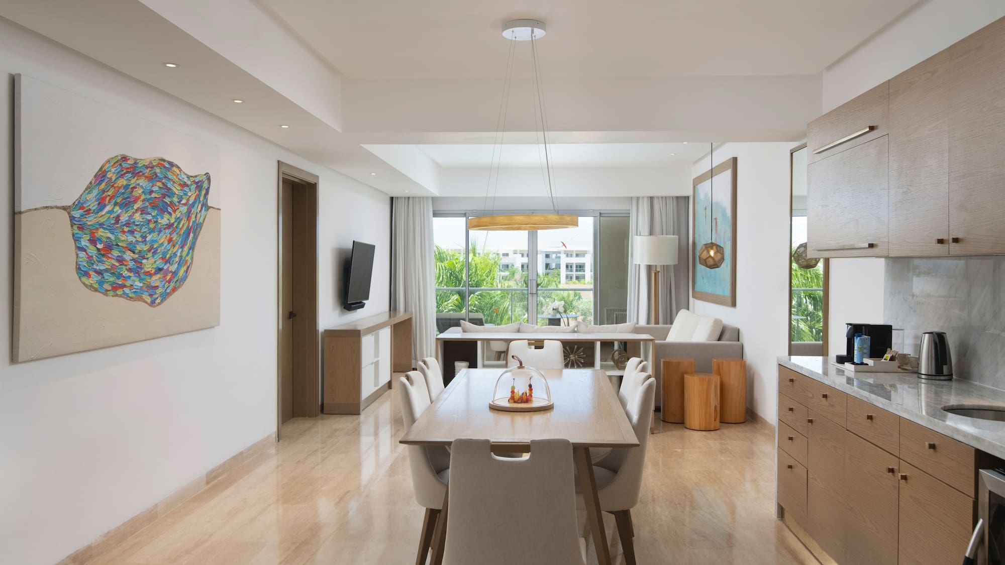 a dining room with a table and chairs
