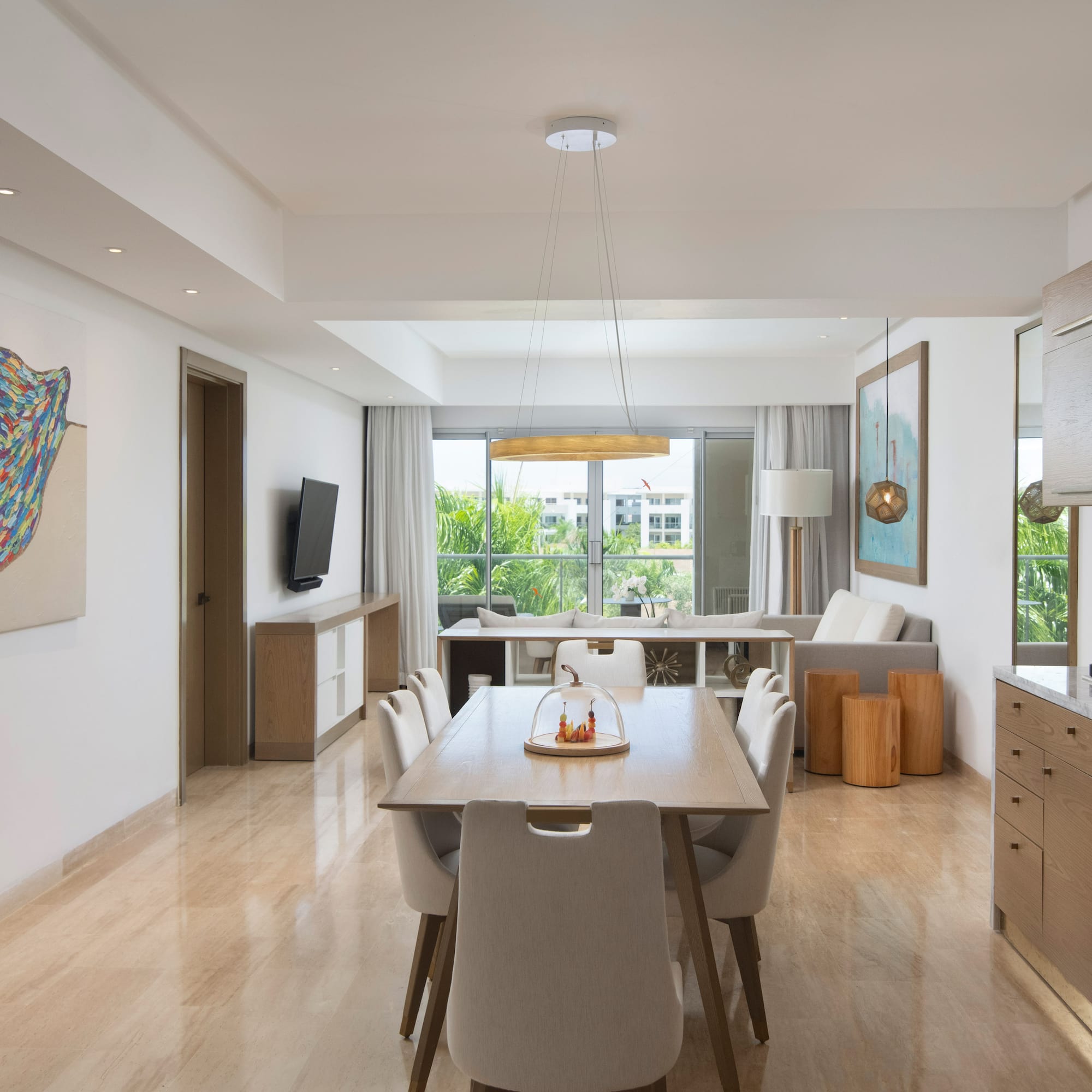 a dining room with a table and chairs