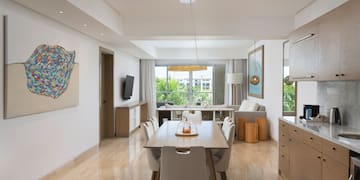 a dining room with a table and chairs