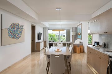 a dining room with a table and chairs