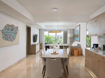 a dining room with a table and chairs