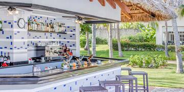 a bar with a stool and a bar counter